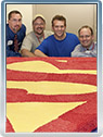 Jamie Reigle, Steve Stanley, Scott Cranford and Jim Bowers with the Superman cake in Cleveland, Ohio, July 2009